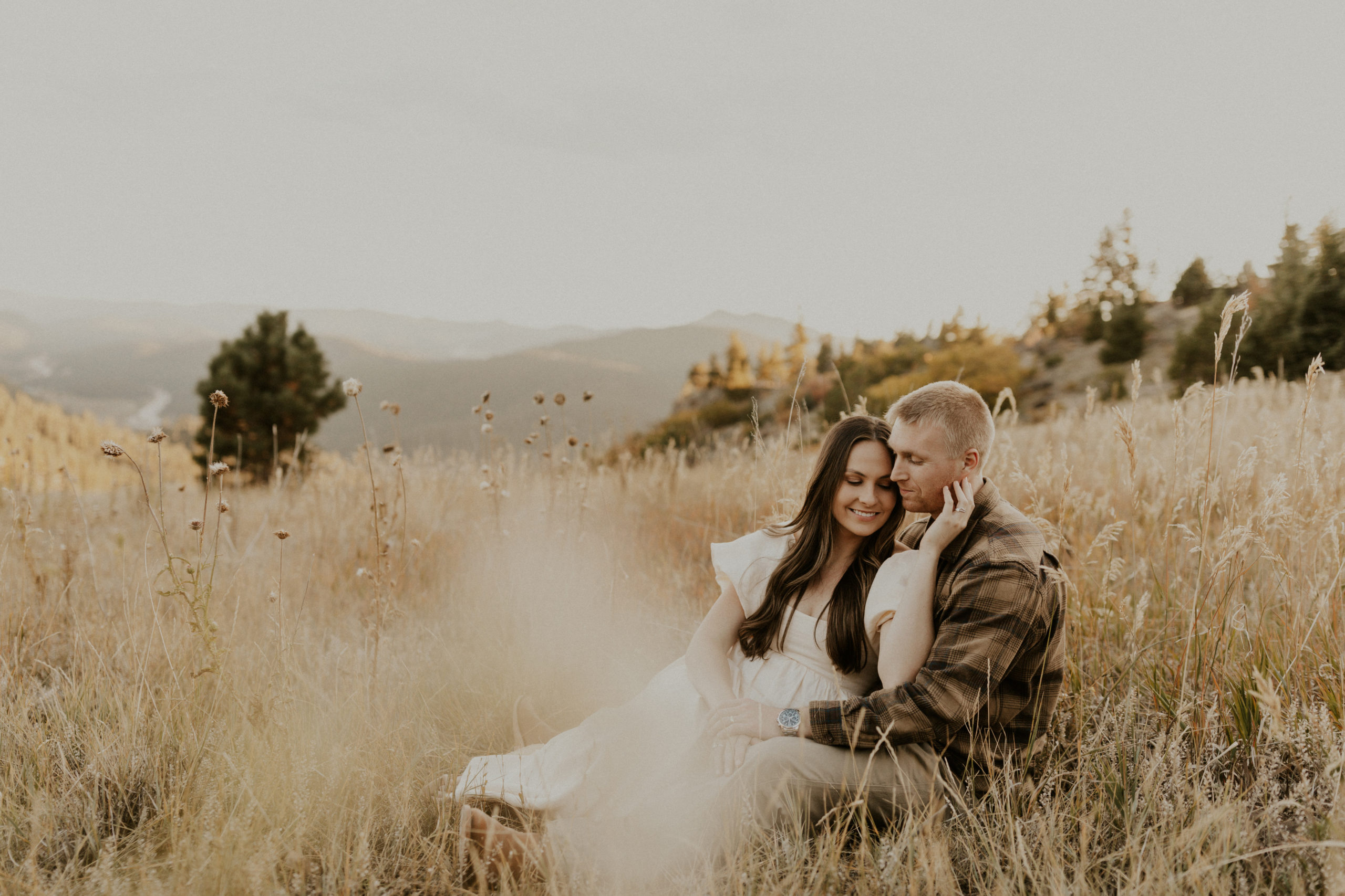 Rocky Mountain Colorado couples session with neutral outfits and dog.