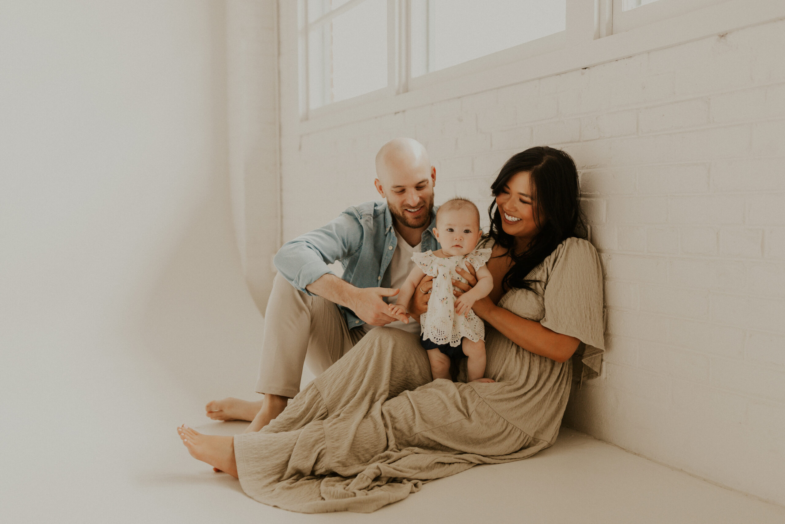 Lifestyle family session with 3 month old newborn in a Denver photo studio