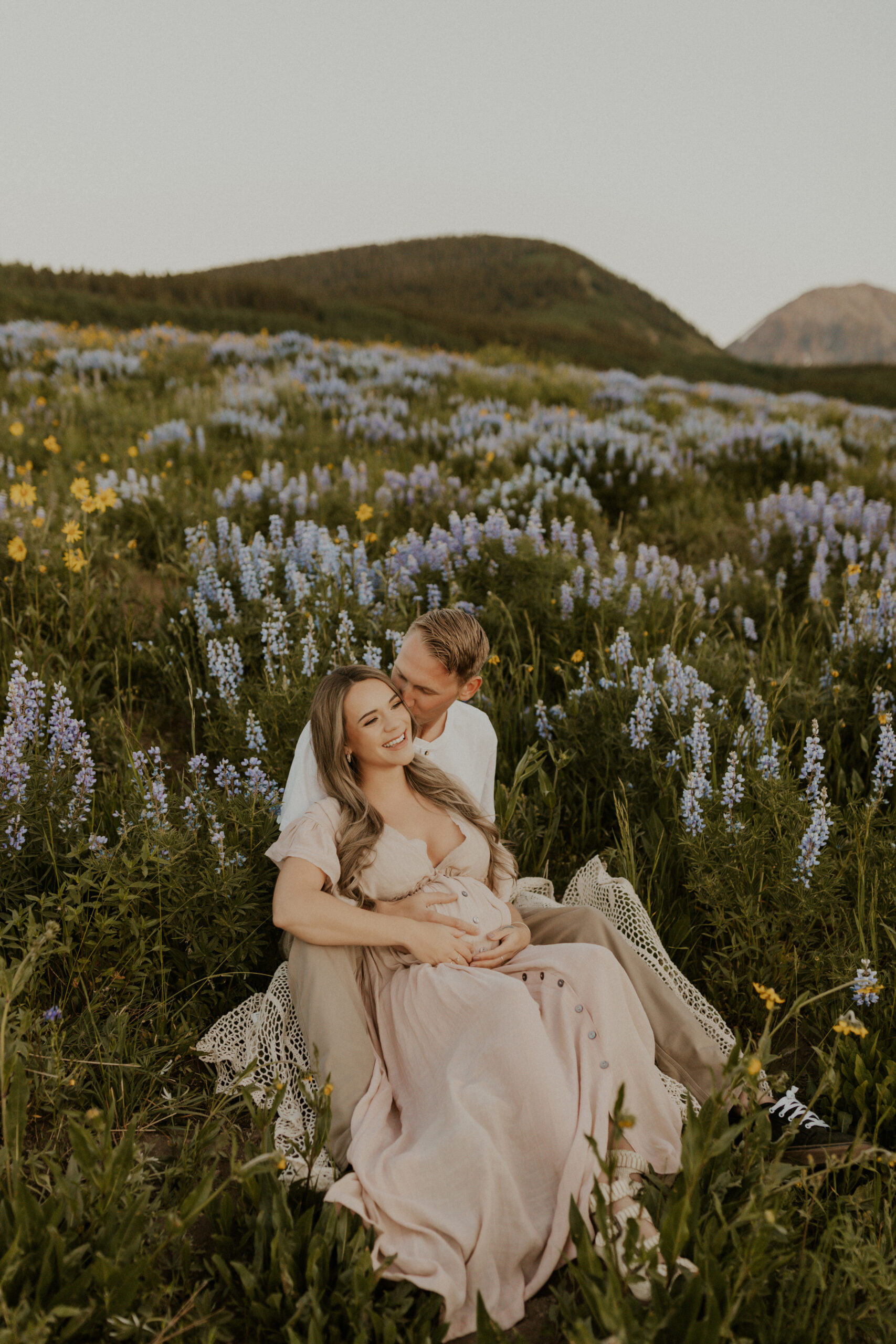 Dreamy sunrise maternity session in the Crested Butte, Colorado wildflower season.