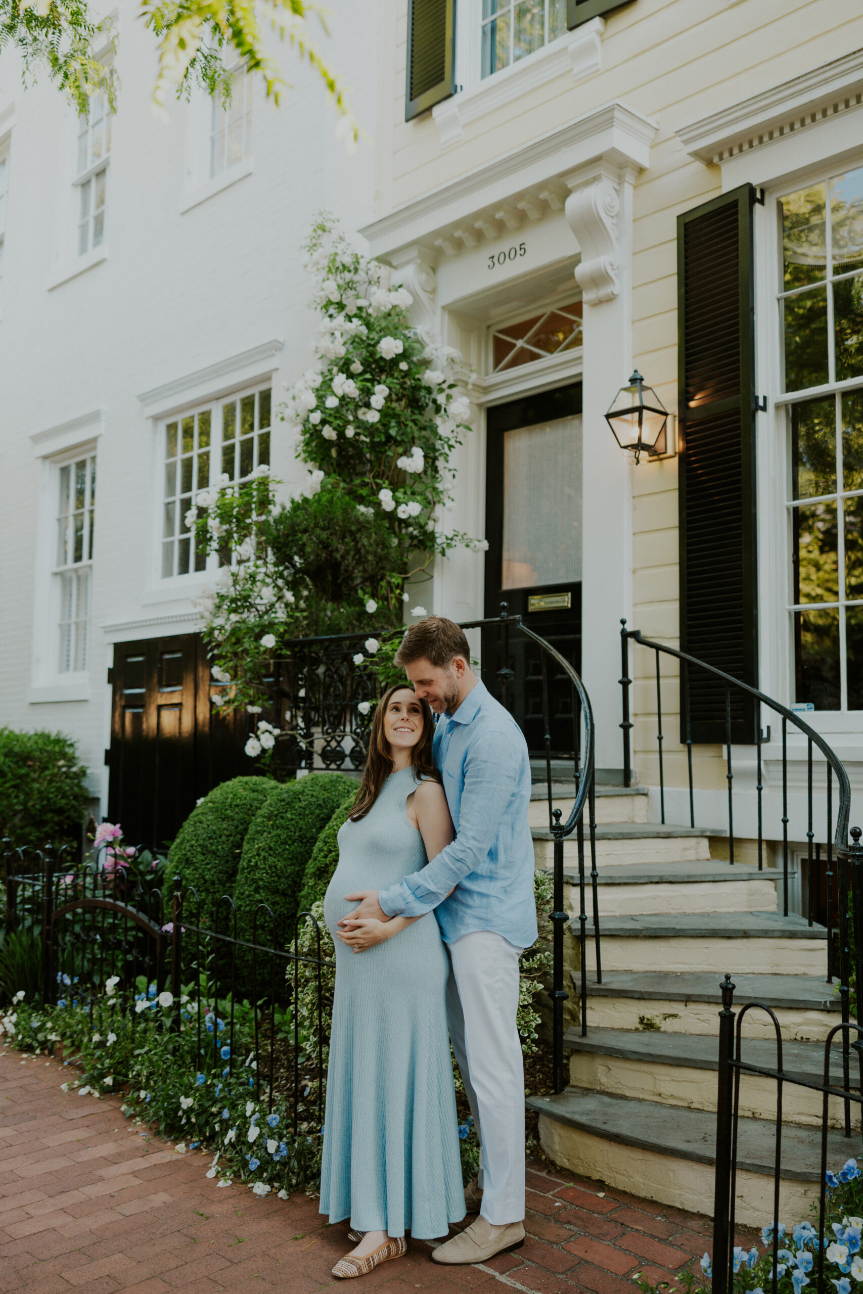 Relaxed maternity portraits in quiet residential street in Georgetown DC with historic rowhomes
